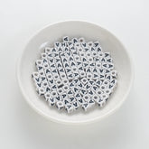 BD00112-01-black-letter-white-opaque-cube-alphabet-beads-single-a-7mm